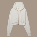 Crop zip hoodie with the words "be kind studios" embroidered on the front.