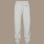 Scrunch leg sweat pants with the words "be kind studios" embroidered on the front.