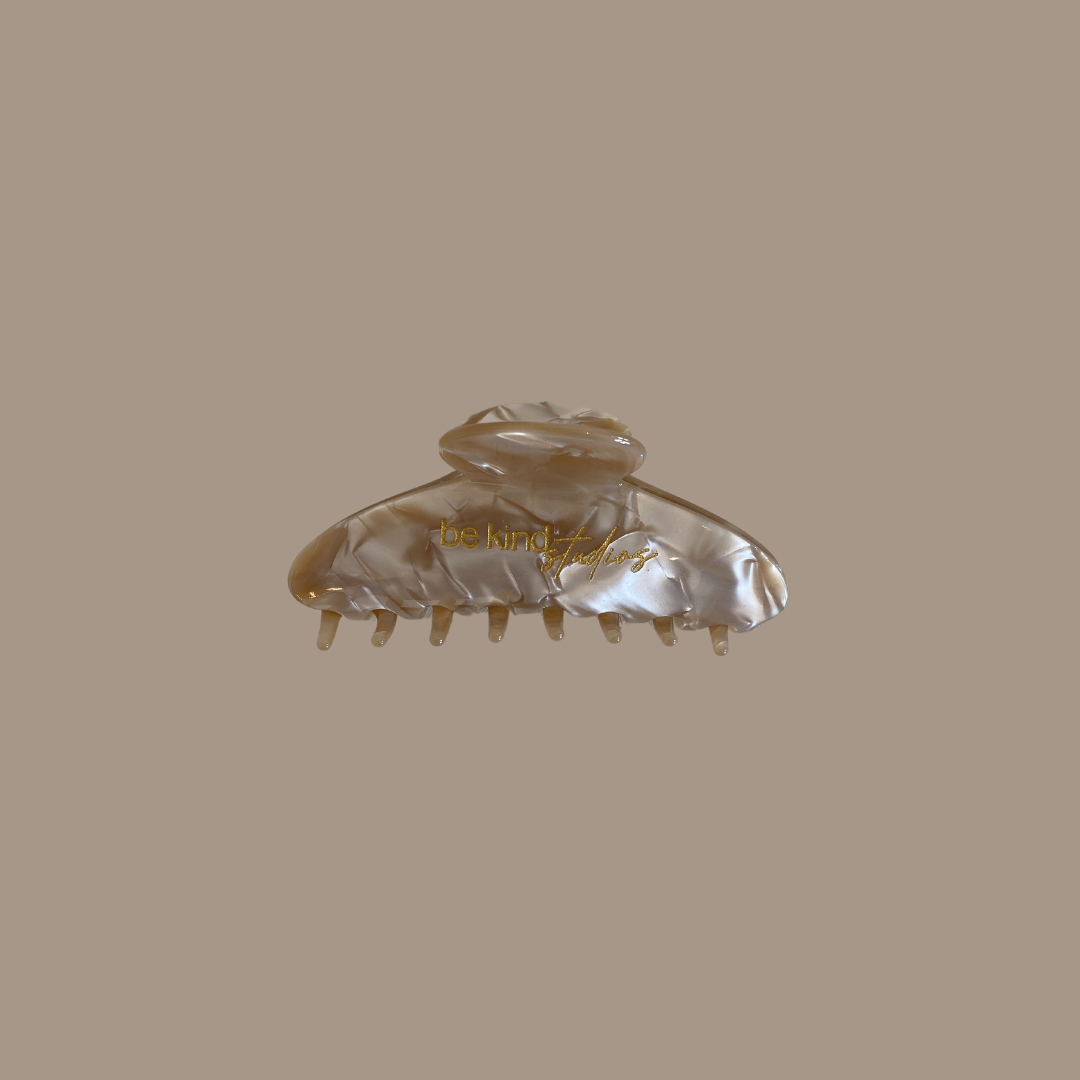 Gold marble hair clip that says Be Kind Studios