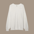 Oversized crew neck with the words "be kind studios" embroidered on the front.